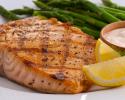 Our freshly prepared fish is paired with fresh lemon wedges to add a special touch and asparagus.