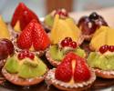 A platter that features a variety of our mini desserts all topped with fresh fruit.